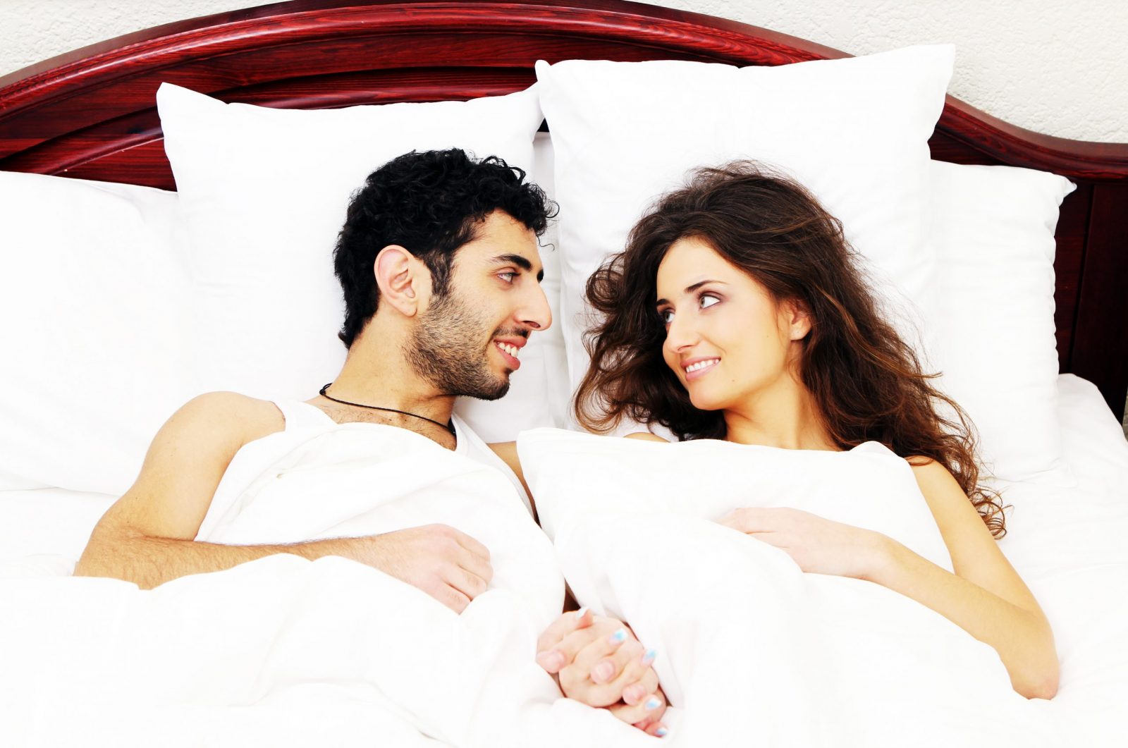 Young and beautiful couple in bed